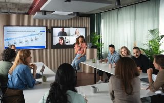 Picture of a collaboration space with woman speaking into a microphone